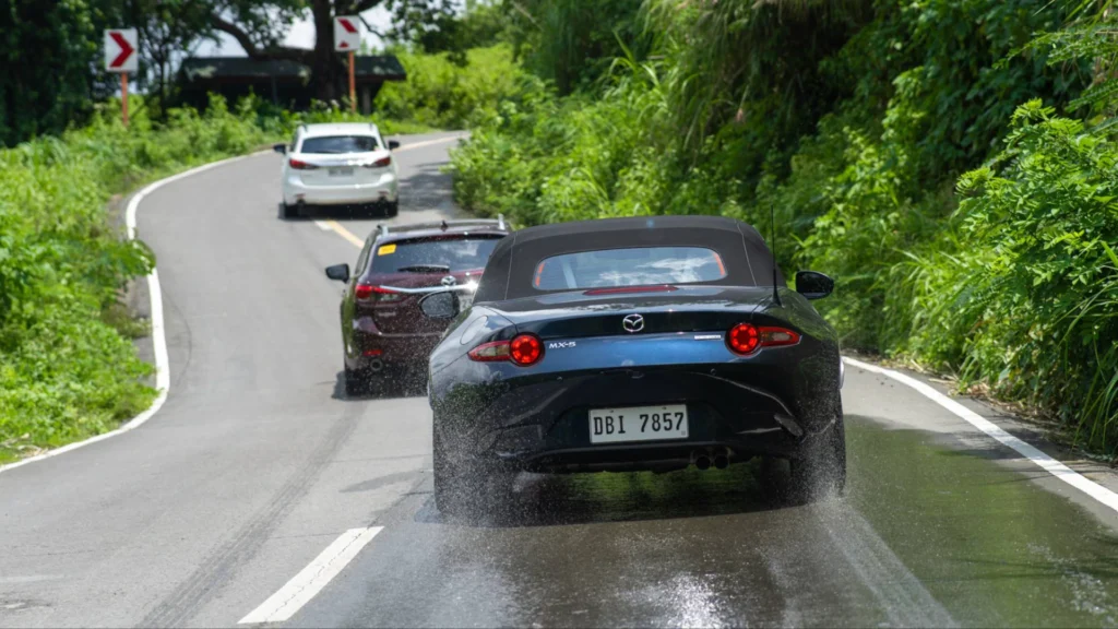 photo of mazda cars on the road