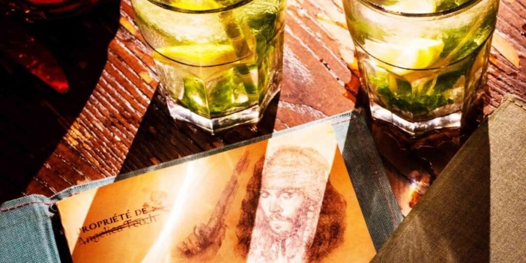 Two glasses of alcohol next to the Captain Jack's menu at Disneyland Paris