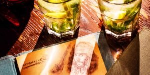 Two glasses of alcohol next to the Captain Jack's menu at Disneyland Paris