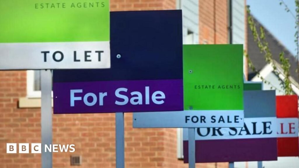 Generic For Sale and To Let Estate Agent signs lined up outside a new build housing and flats estate development