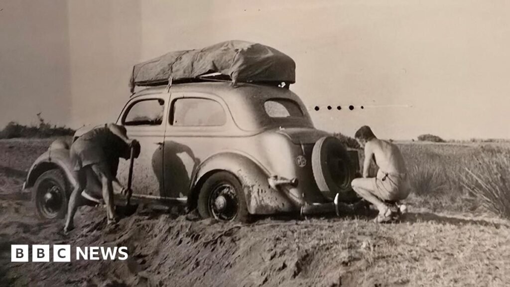 A historical photo showing the four men - John Everest, John Willmore, Peter Taylor, and John McQueen - on a stop off in 1959