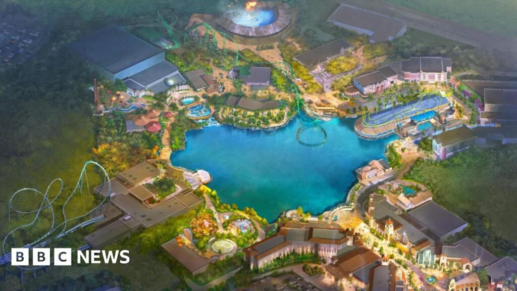 An artist's impression of the proposed Universal theme park. There is a lake in the middle with various rides and buildings around the edge.