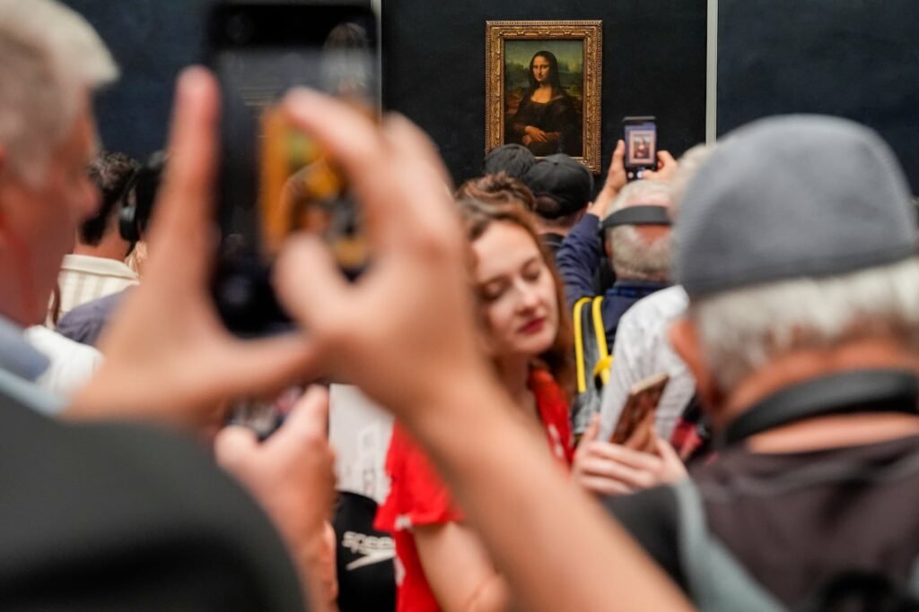 A crowd around the "Mona Lisa" in the Louvre museum in Paris on Aug. 31.