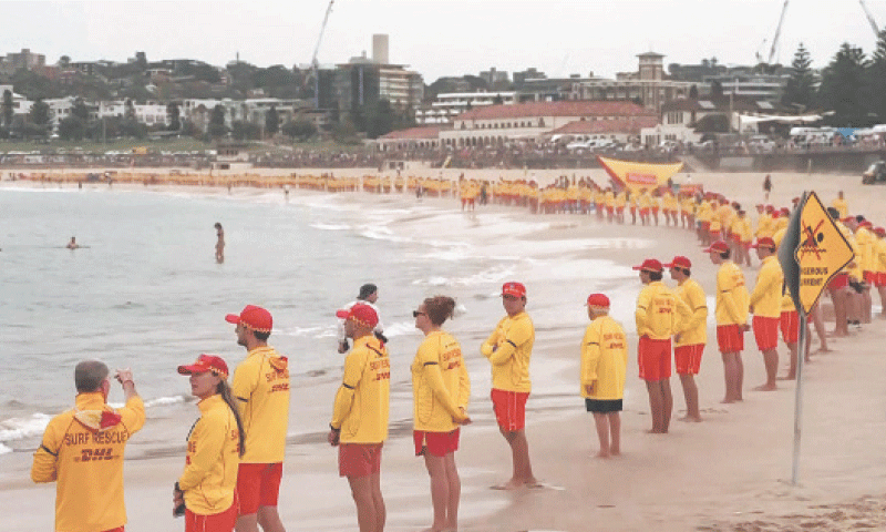 Australian lifeguards fall silent for Bondi beach victims - Newspaper