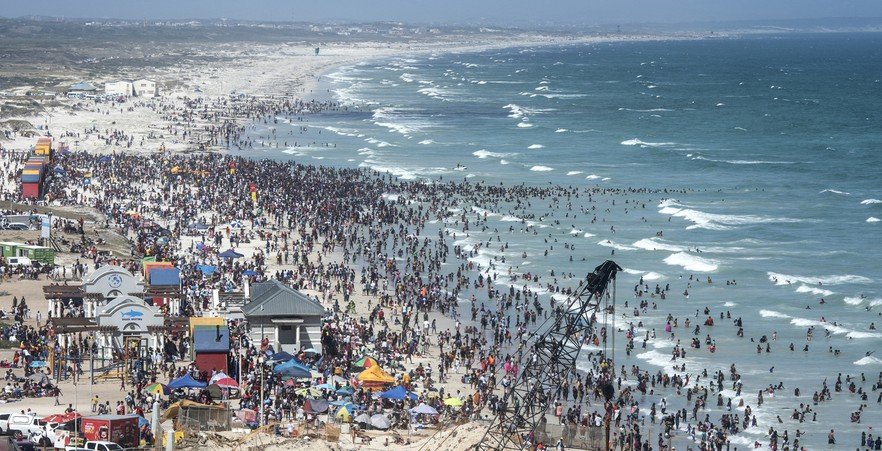 In photos: Thousands flock to Muizenberg beach to celebrate new year