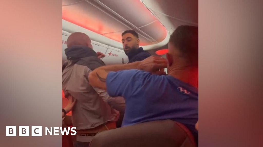 Jet2 hands passengers life ban after mid-air brawl - BBC