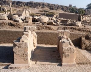 Restored gateway structure with visible hieroglyphic carvings