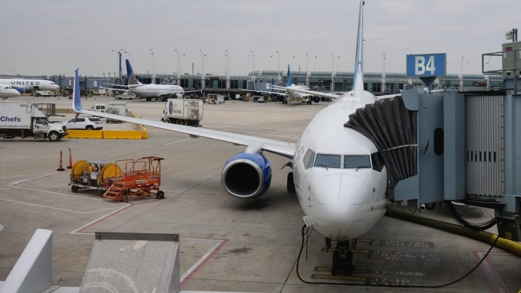 A United plane waiting at a gate.