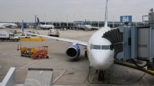 A United plane waiting at a gate.