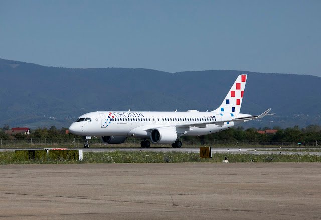 A Croatia Airlines A220 taxiing at the airport