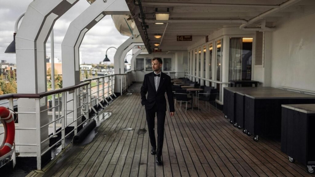 Employee walking on the deck of a cruise ship