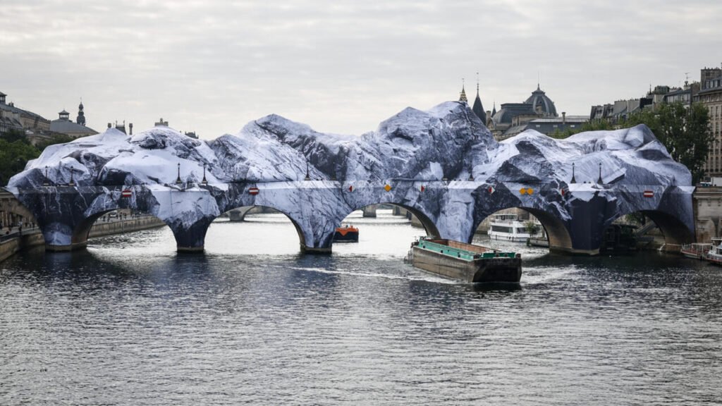 'French Banksy' and Daft Punk star turn Paris bridge into Alpine cave