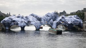 'French Banksy' and Daft Punk star turn Paris bridge into Alpine cave