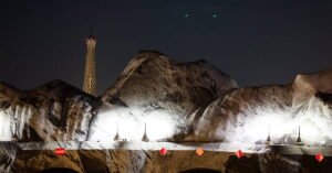 French artist JR begins his giant ‘cave’ art inflation over Paris’ oldest bridge