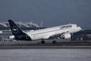 Lufthansa aircraft departing from a snowy runway