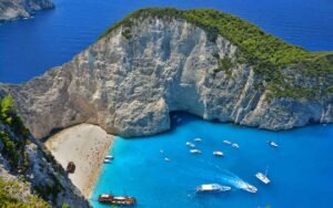 Tourist rescued from sheer cliff over iconic beach