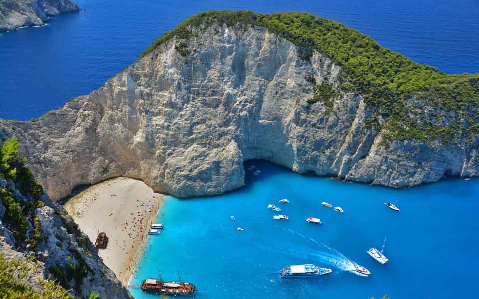 Tourist rescued from sheer cliff over iconic beach