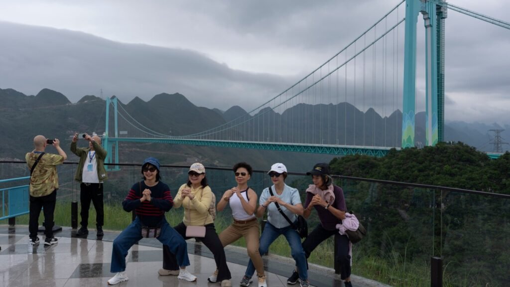 China's highest bridge brings tourists and internet access to remote communities : NPR